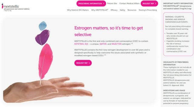A website with a hand holding a pink feather.