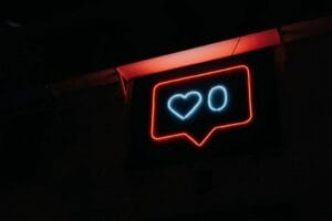 A neon sign with a heart on it.