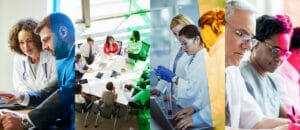 A group of people working on laptops in an office.